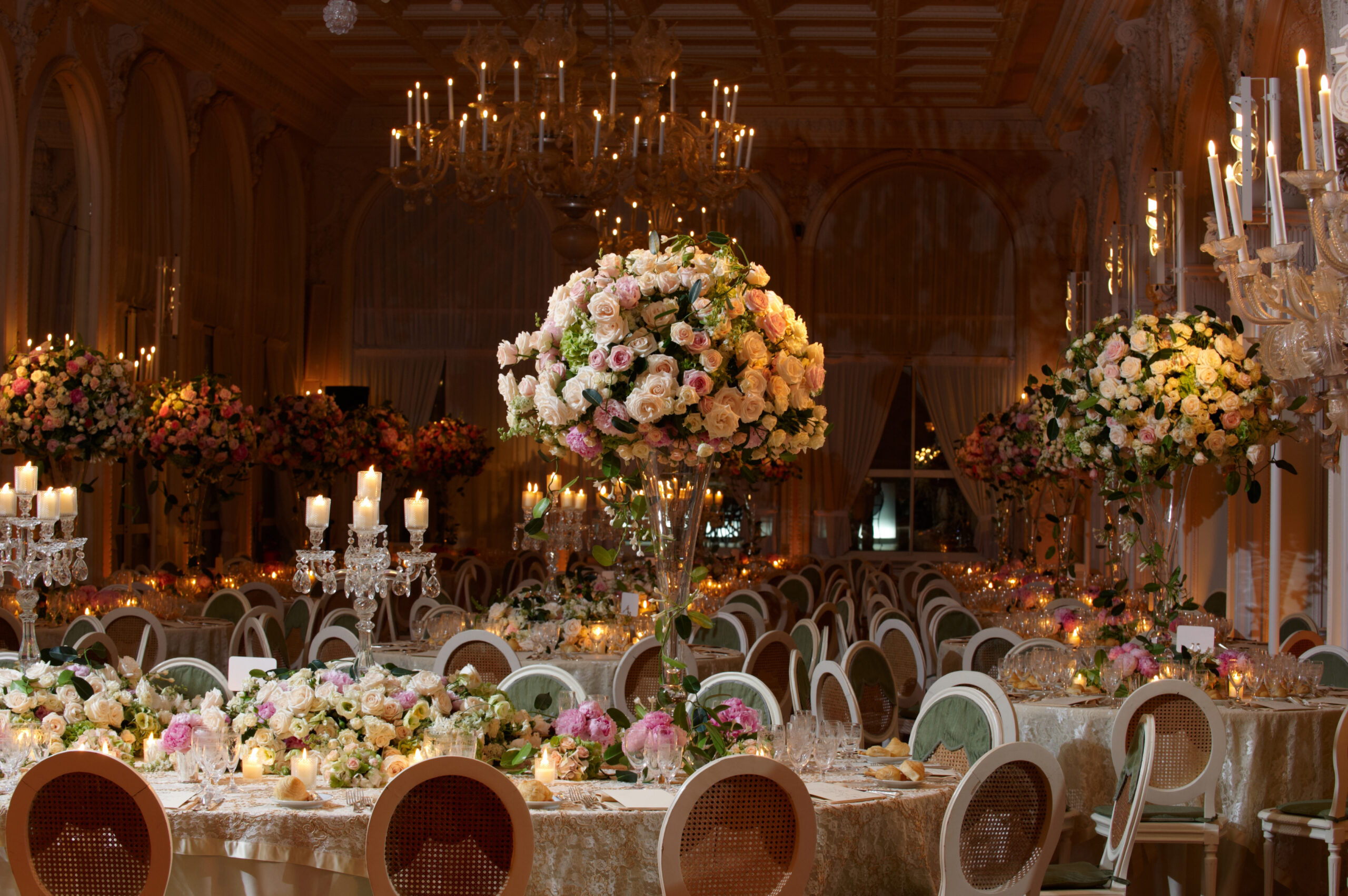 A beautiful wedding table setting with crystal candle holders and flower arrengments